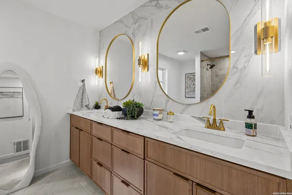 a bath room with a bathtub and shower