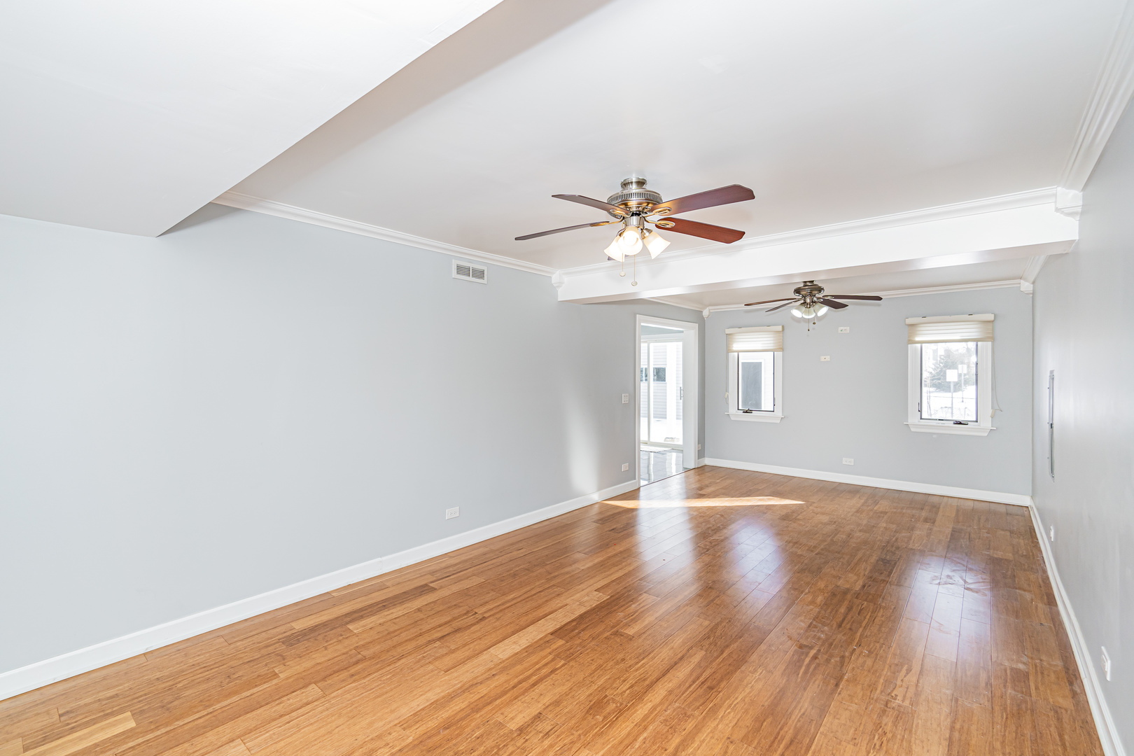 548 Harbor Terrace Bartlett, IL 60103 - Photo 17 of 42 a view of an empty room with wooden floor and a window