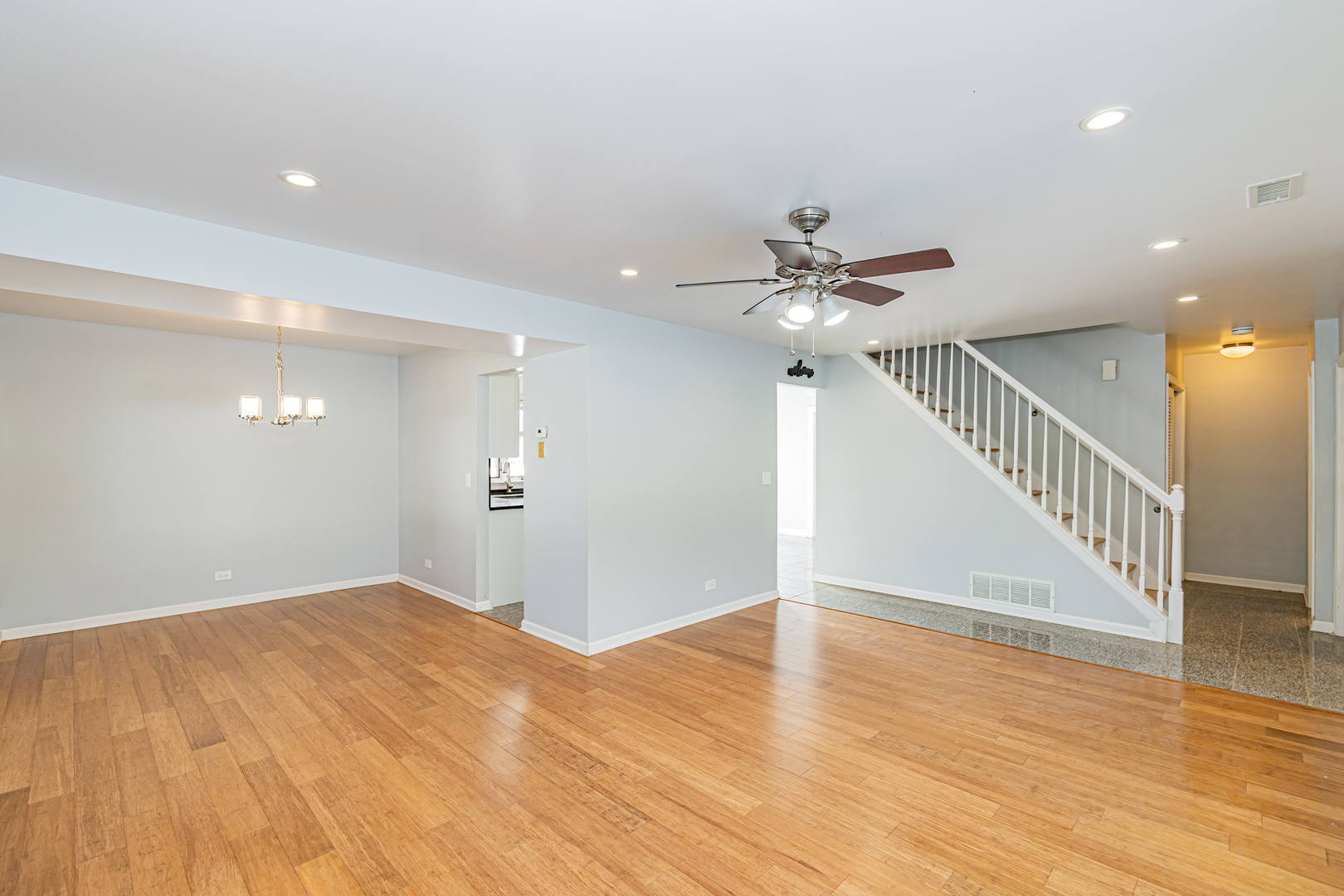 548 Harbor Terrace Bartlett, IL 60103 - Photo 19 of 42 a view of a room with wooden floor and a ceiling fan