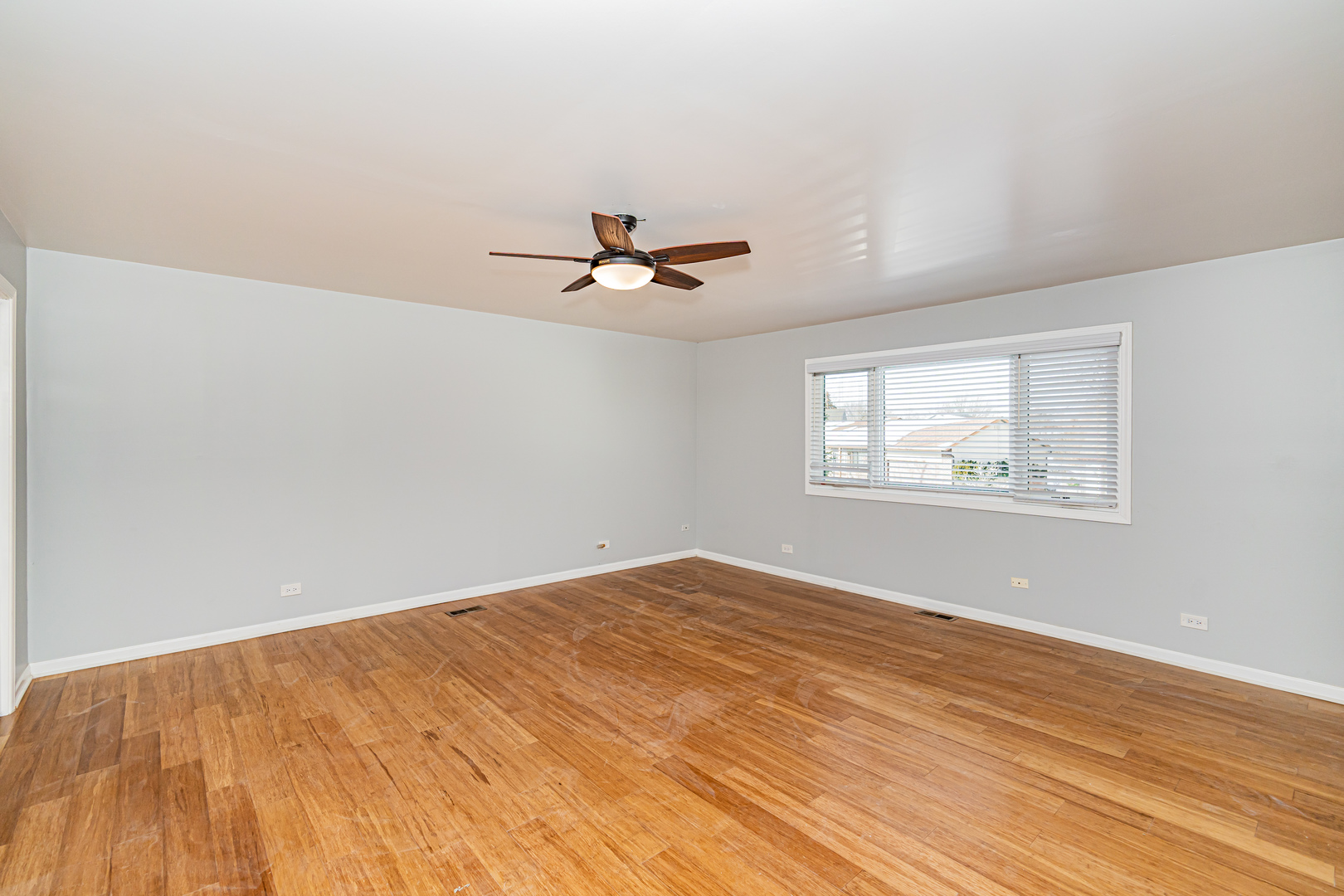 548 Harbor Terrace Bartlett, IL 60103 - Photo 23 of 42 an empty room with wooden floor and windows