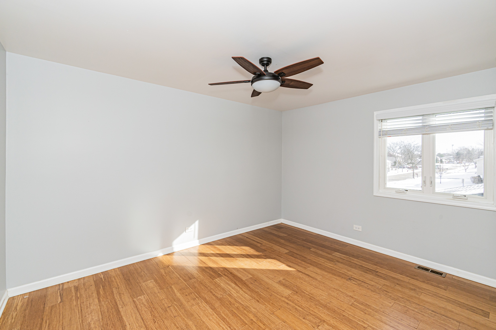548 Harbor Terrace Bartlett, IL 60103 - Photo 27 of 42 a view of a big room with wooden floor and windows