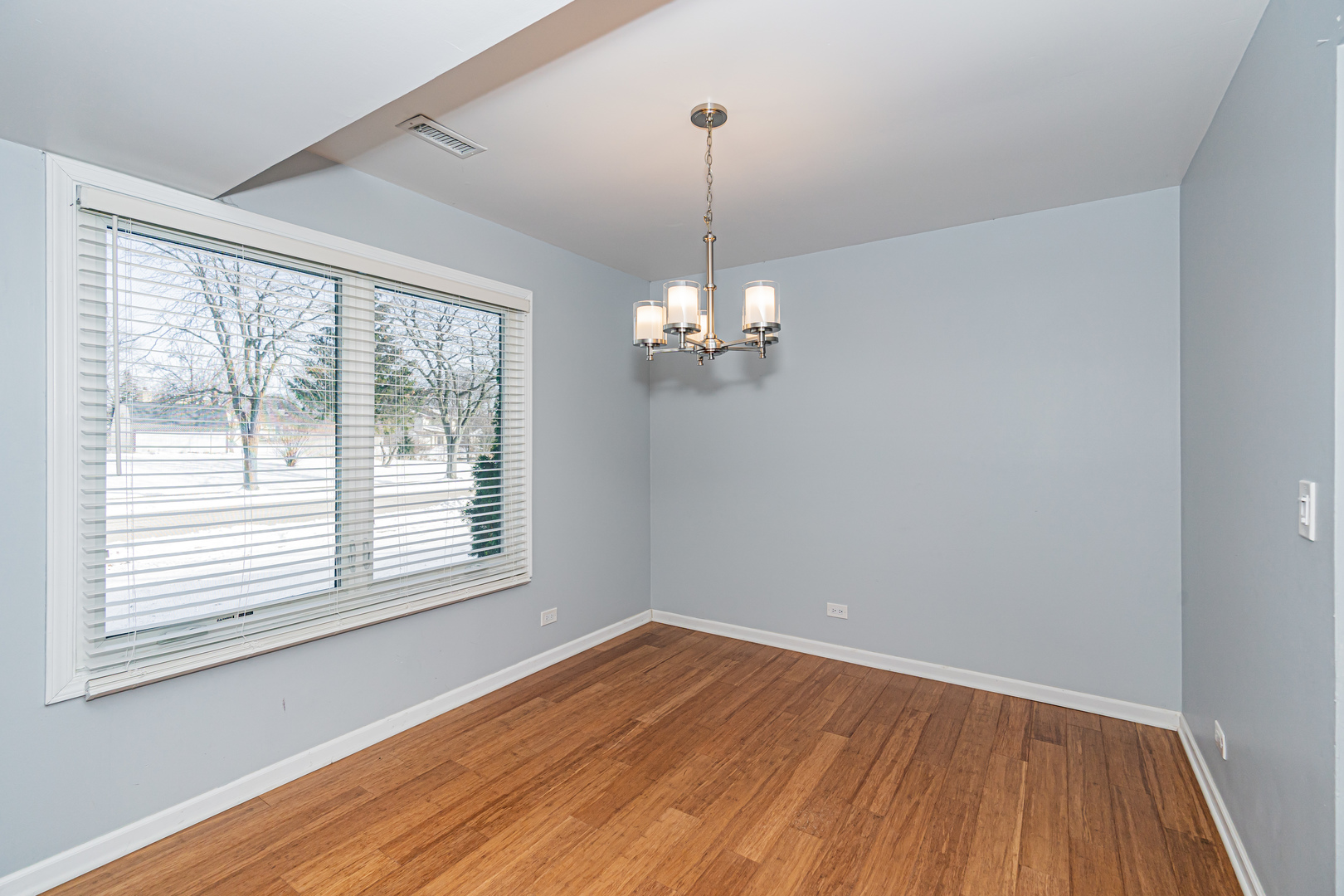 548 Harbor Terrace Bartlett, IL 60103 - Photo 4 of 42 a view of empty room with wooden floor and fan