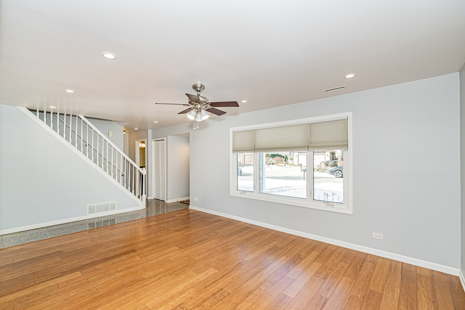 548 Harbor Terrace Bartlett, IL 60103 - Photo 5 of 42 a view of an empty room with wooden floor and a window