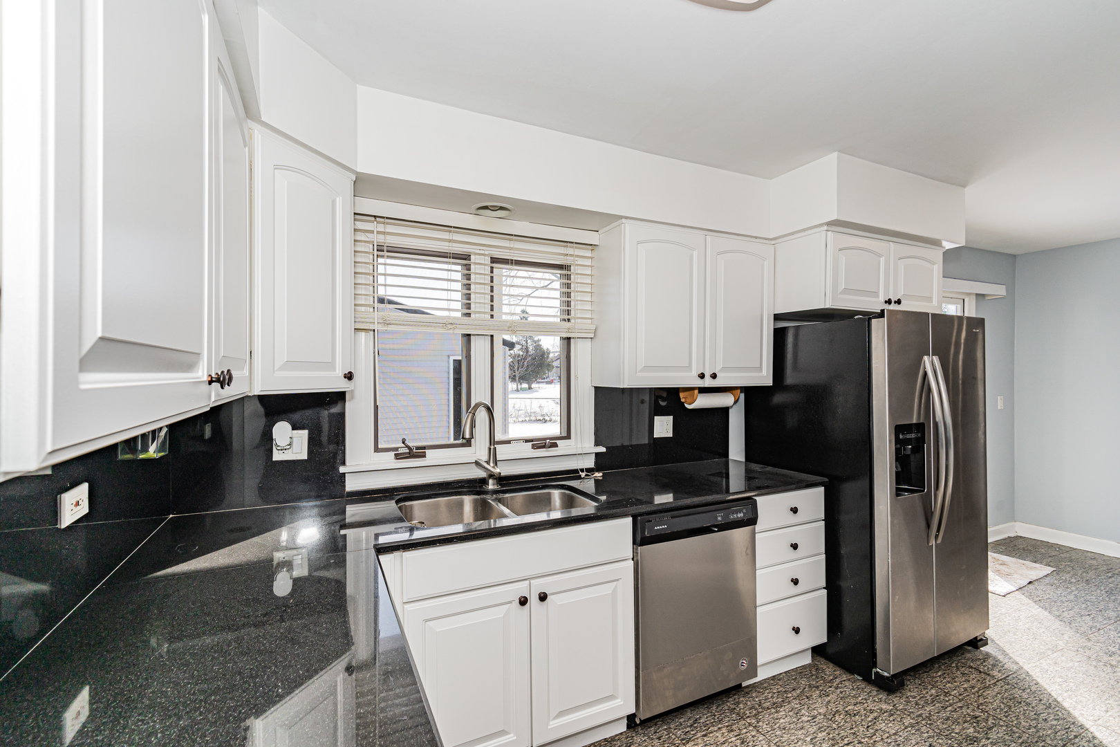 548 Harbor Terrace Bartlett, IL 60103 - Photo 7 of 42 a kitchen with stainless steel appliances a refrigerator sink and stove