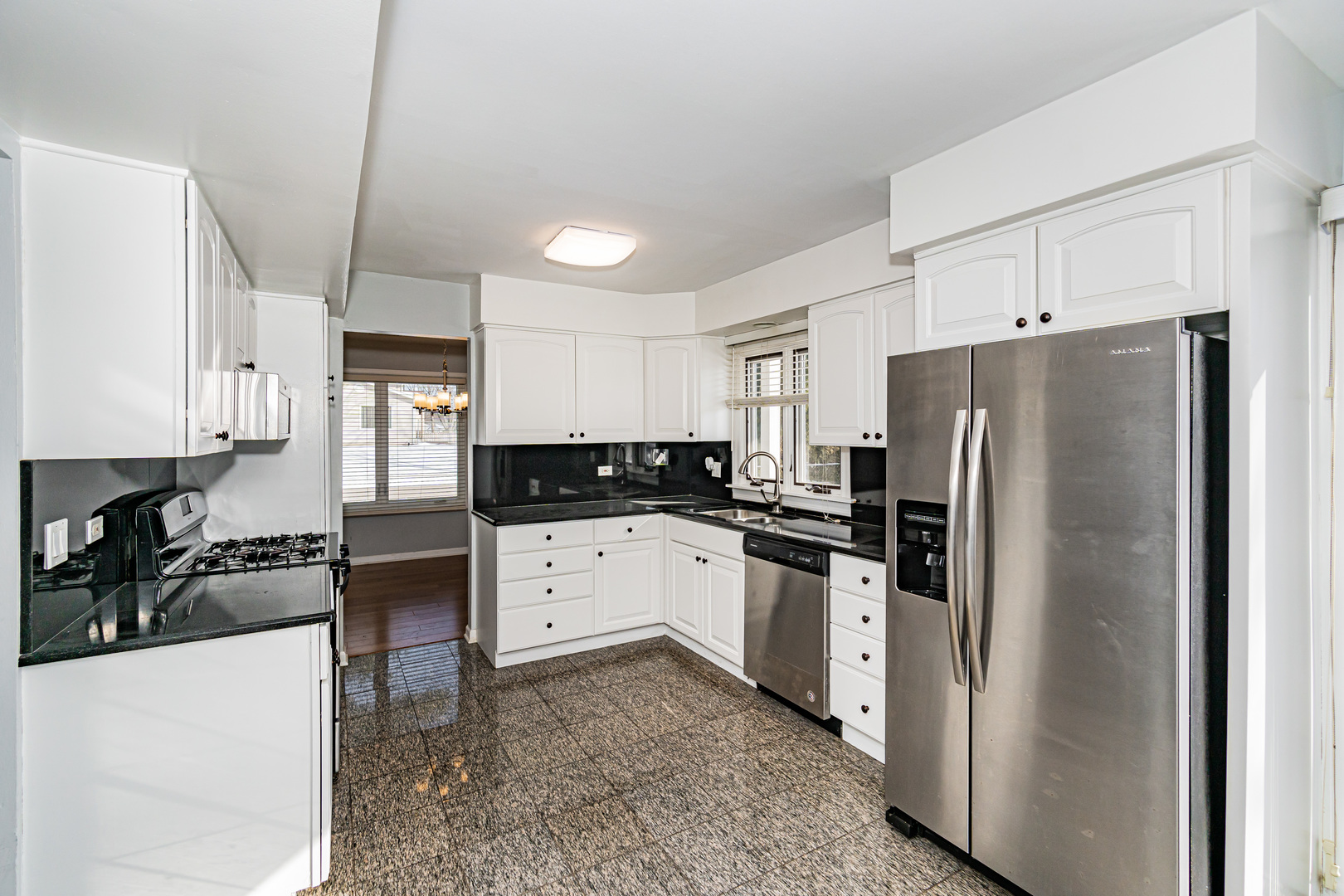 548 Harbor Terrace Bartlett, IL 60103 - Photo 8 of 42 a kitchen with stainless steel appliances a refrigerator stove microwave and sink