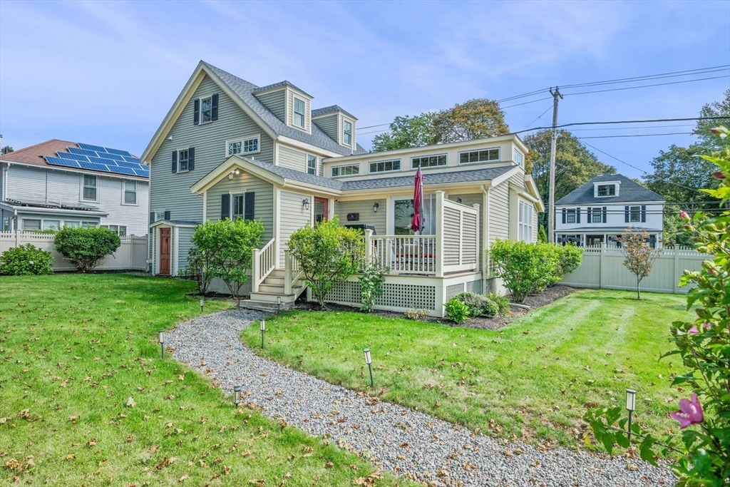 90 Dodge Street Beverly, MA 01915 - Photo 1 of 37 a front view of a house with a yard