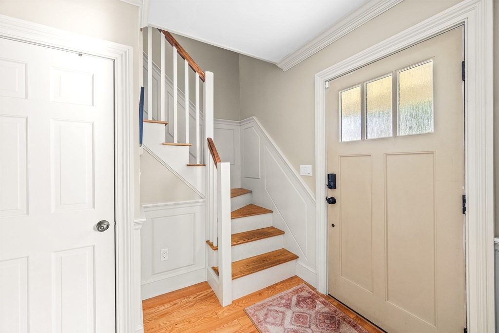 90 Dodge Street Beverly, MA 01915 - Photo 13 of 37 a view of entryway with wooden floor and stair