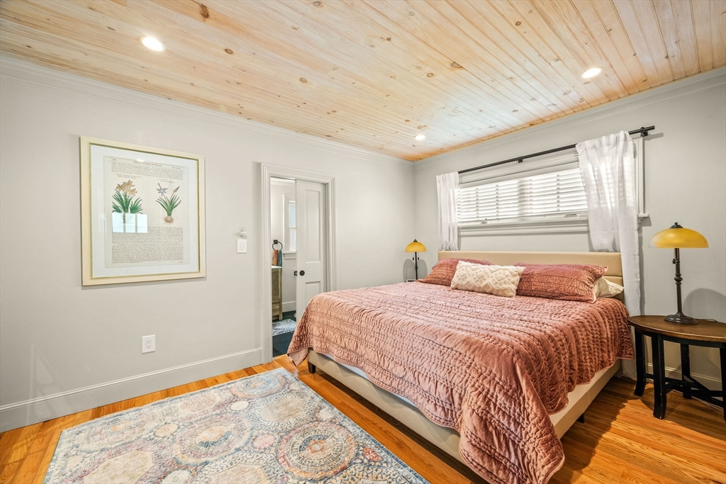 90 Dodge Street Beverly, MA 01915 - Photo 14 of 37 a bedroom with a bed wooden floor and window