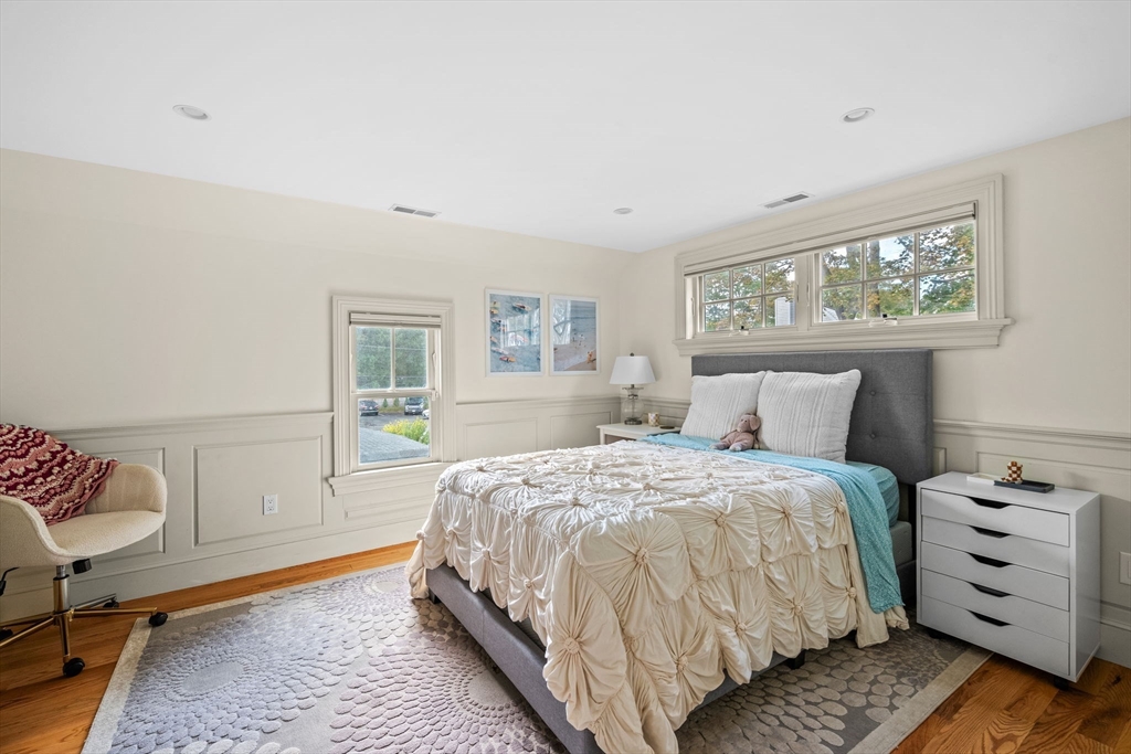 90 Dodge Street Beverly, MA 01915 - Photo 17 of 37 a bedroom with a bed and wooden floor