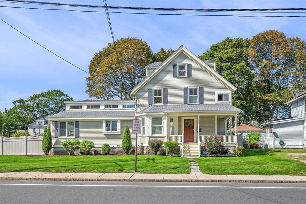 90 Dodge Street Beverly, MA 01915 - Photo 2 of 37 a front view of a house with a garden