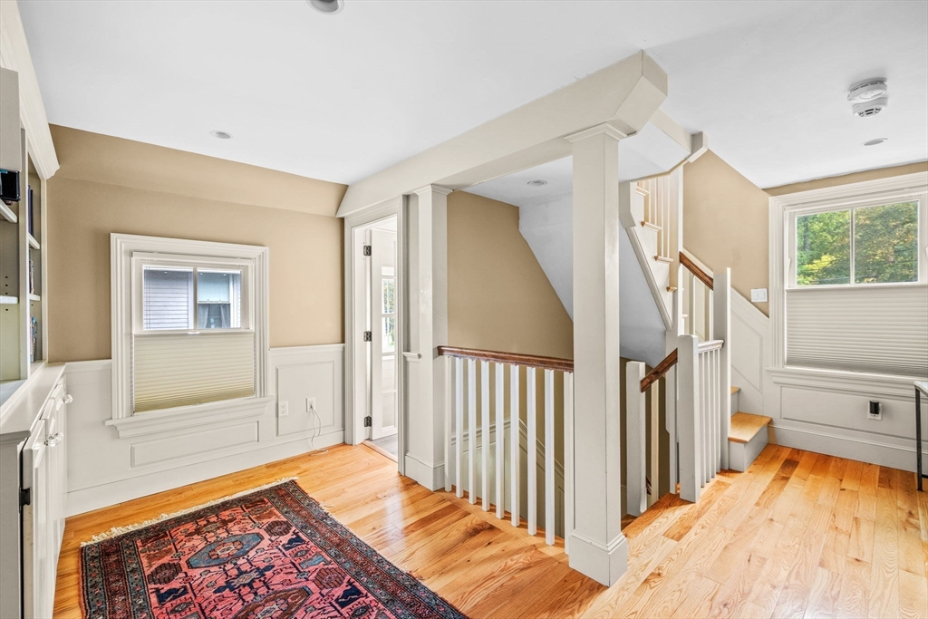 90 Dodge Street Beverly, MA 01915 - Photo 21 of 37 a view of a hallway with wooden floor and staircase