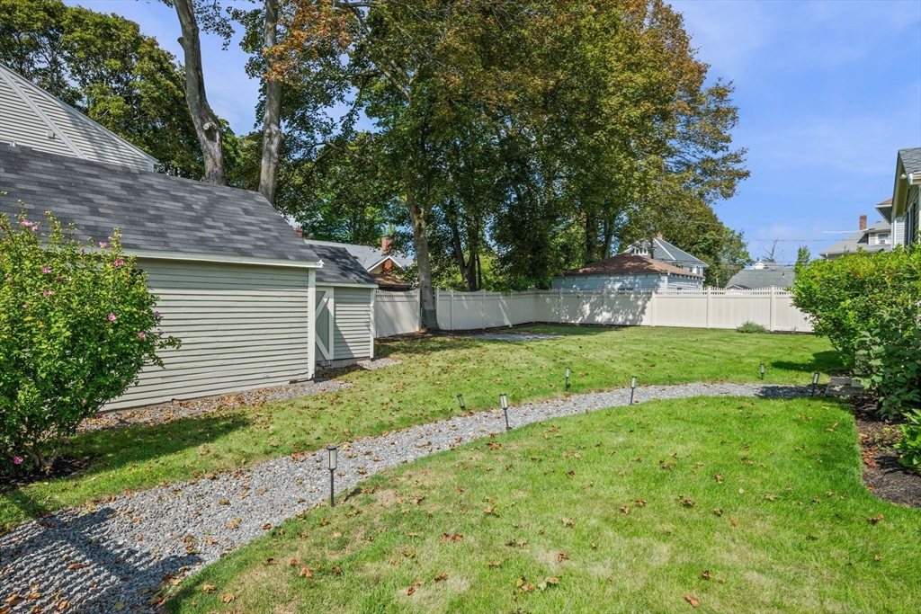 90 Dodge Street Beverly, MA 01915 - Photo 30 of 37 a view of a house with a yard