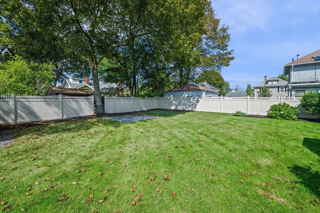 90 Dodge Street Beverly, MA 01915 - Photo 31 of 37 a view of a backyard with a garden and trees