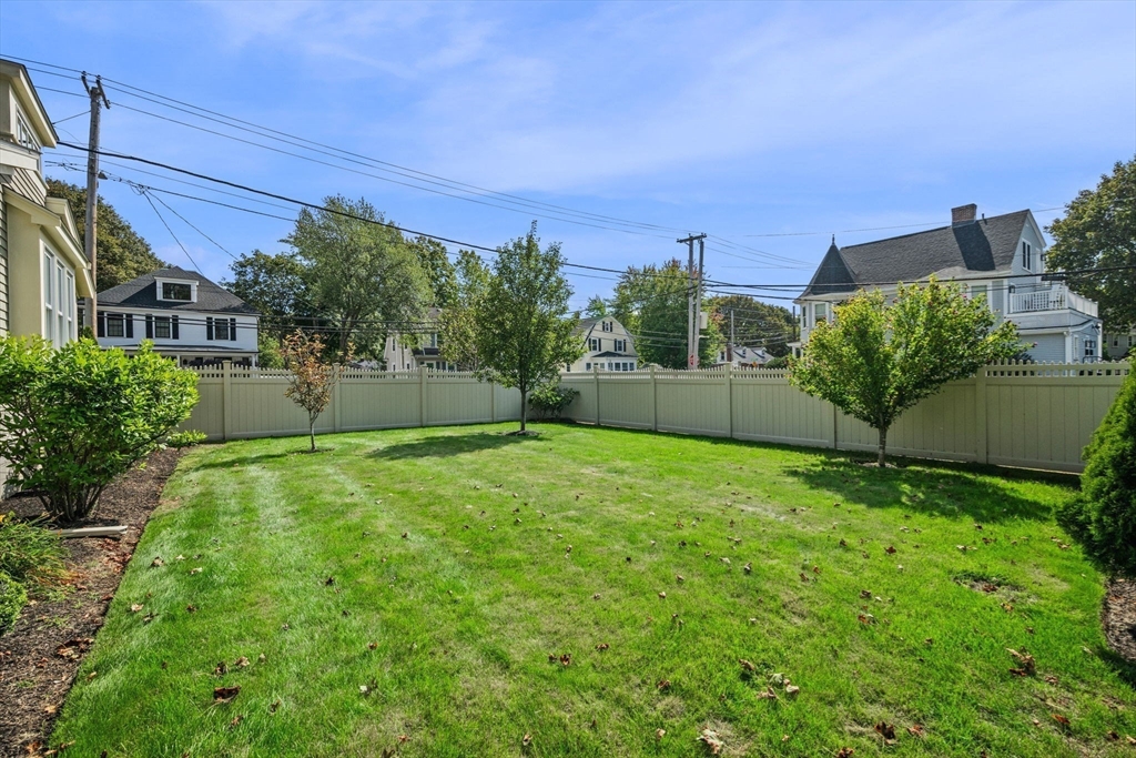 90 Dodge Street Beverly, MA 01915 - Photo 32 of 37 a view of a backyard with plants and a garden