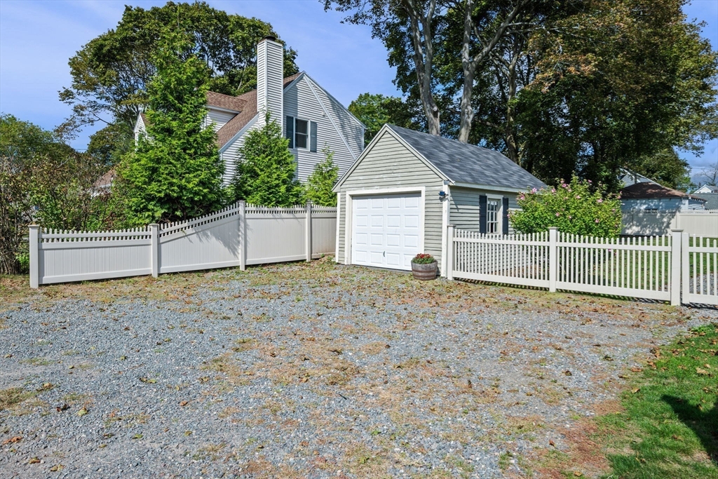 90 Dodge Street Beverly, MA 01915 - Photo 33 of 37 a view of a house with a yard and large tree