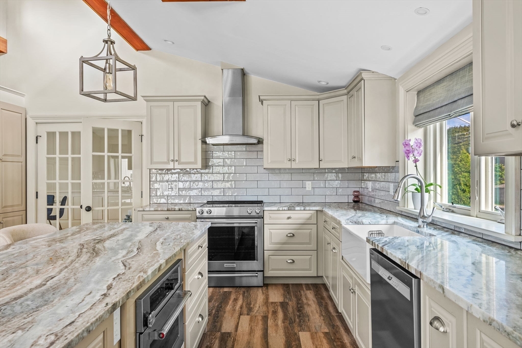 90 Dodge Street Beverly, MA 01915 - Photo 4 of 37 a kitchen with stainless steel appliances granite countertop a stove and a sink