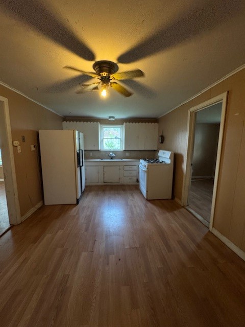 501 Reagan Street South West, TX 76691 - Photo 7 of 12 a view of a livingroom with furniture and wooden floor