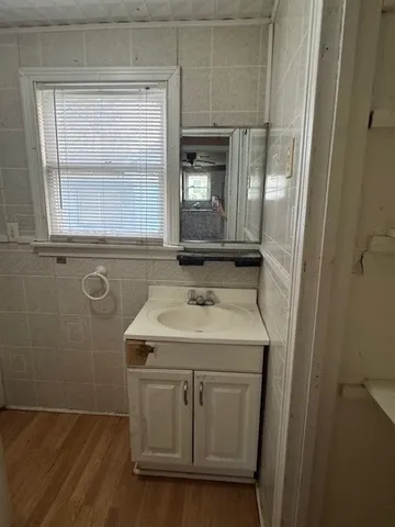 a bathroom with a sink a vanity and a mirror
