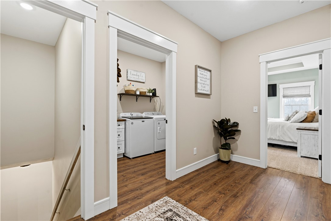 1158 Pyle Road Clarksville, OH 45113 - Photo 27 of 76 This welcoming hallway connects a functional laundry area with a comfortable bedroom.