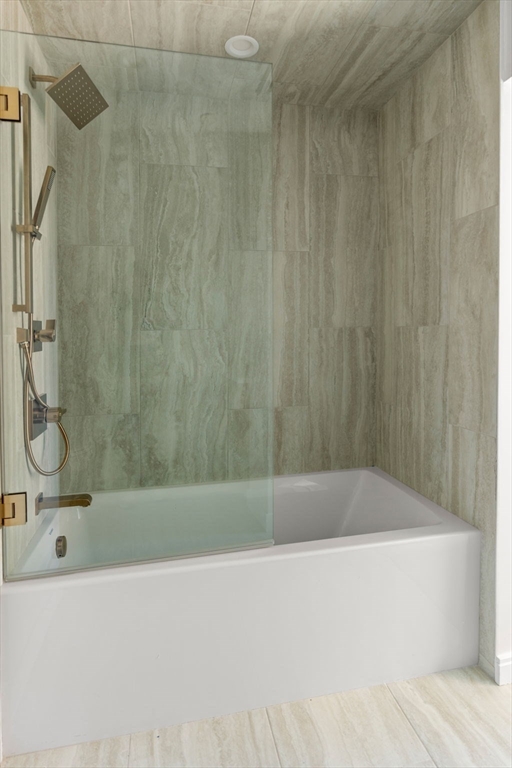 125 Lowell Street, Unit 402 Somerville, MA 02143 - Photo 20 of 34 a bathroom with a bathtub and a shower