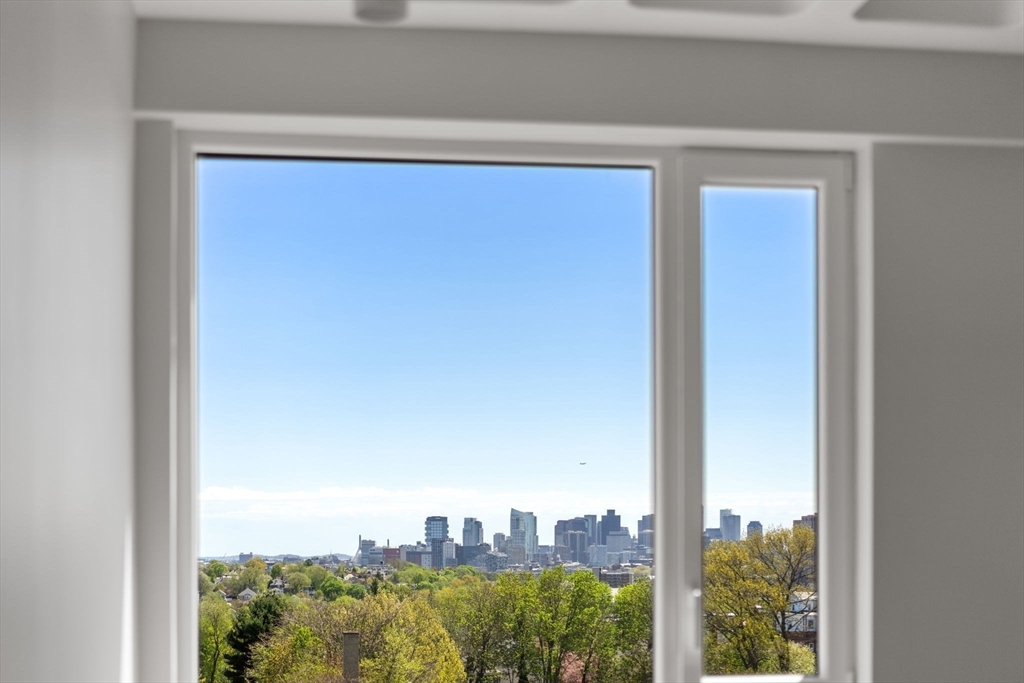 125 Lowell Street, Unit 402 Somerville, MA 02143 - Photo 21 of 34 a view of a lake from a window