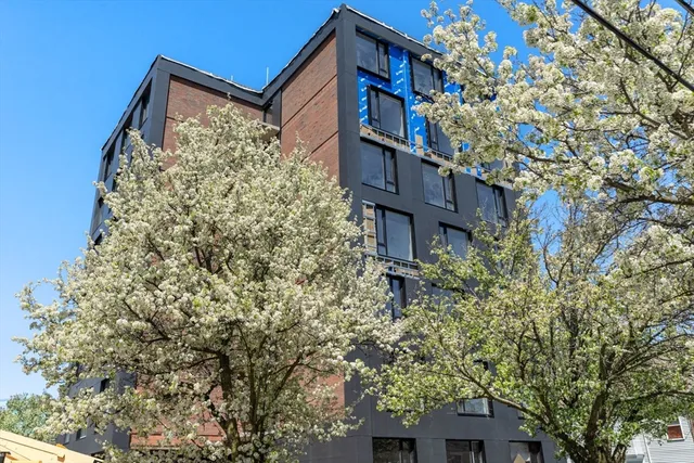 a living room with a chandelier furniture and a chandelier