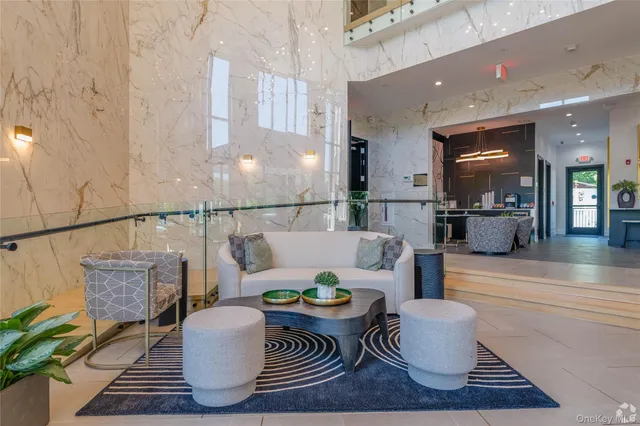 a living room with furniture and a rug