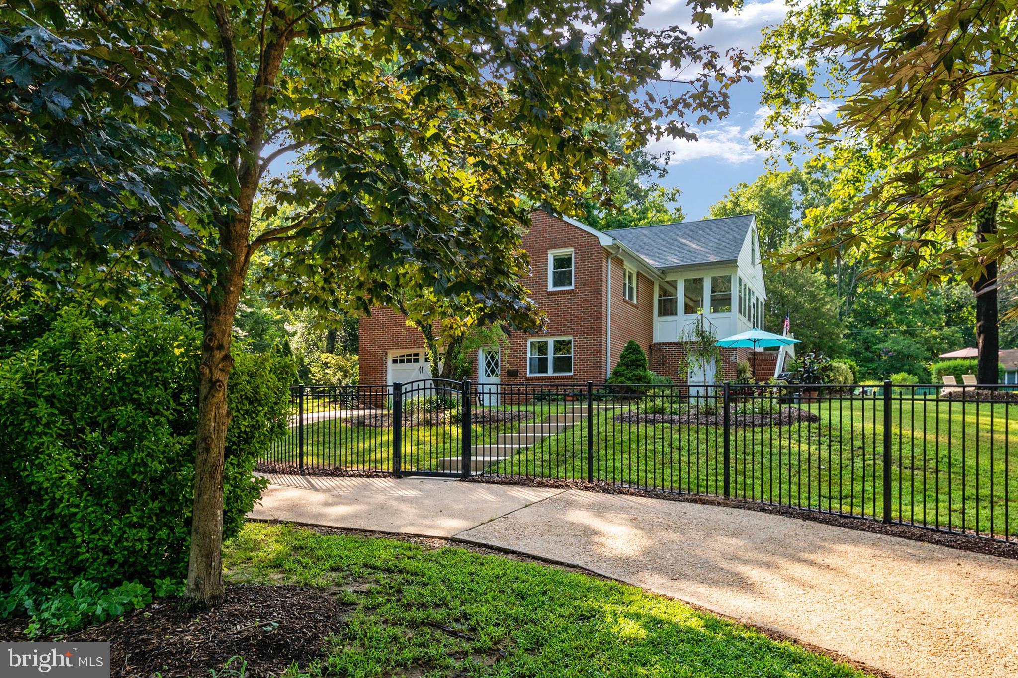 2807 Hambleton Road Riva, MD 21140 - Photo 8 of 55 a view of a backyard with large trees and plants