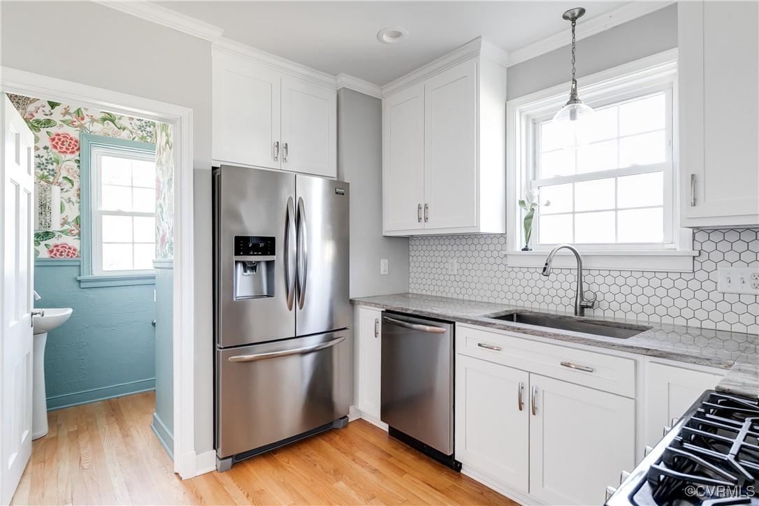 5108 King William Road Richmond, VA 23225 - Photo 13 of 38 a kitchen with a refrigerator sink and cabinets
