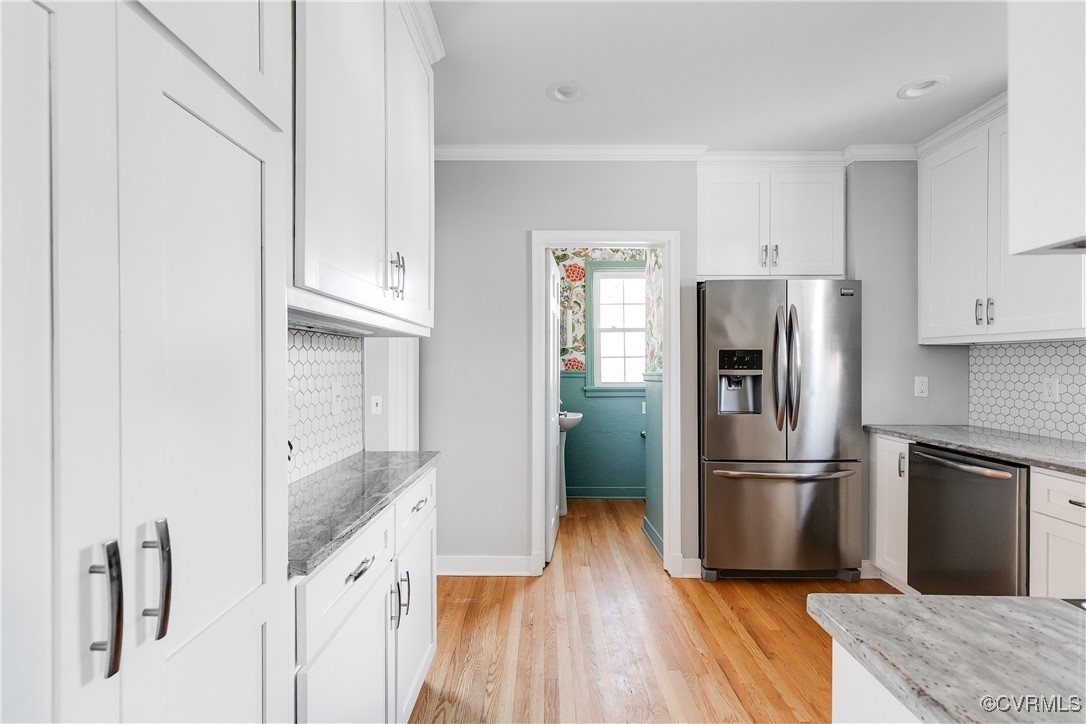 5108 King William Road Richmond, VA 23225 - Photo 14 of 38 a kitchen with granite countertop a refrigerator and a sink