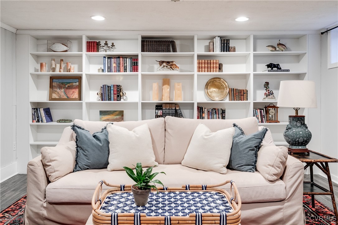 5108 King William Road Richmond, VA 23225 - Photo 18 of 38 a living room with a book shelf and a book shelf