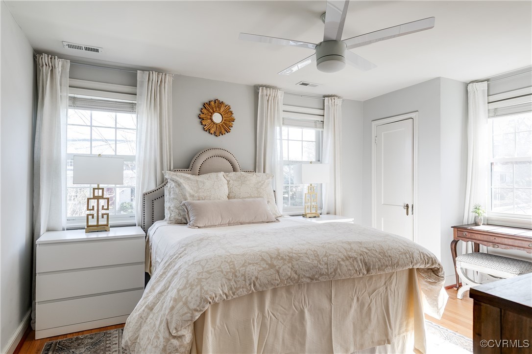 5108 King William Road Richmond, VA 23225 - Photo 28 of 38 a bedroom with a bed and a chandelier
