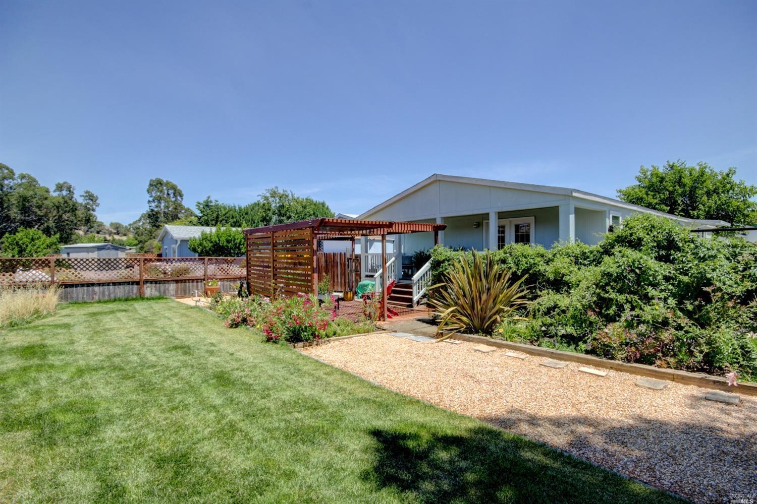 12 Yosemite Road, Unit 12 San Rafael, CA 94903 - Photo 1 of 1 a view of a house with backyard porch and sitting area
