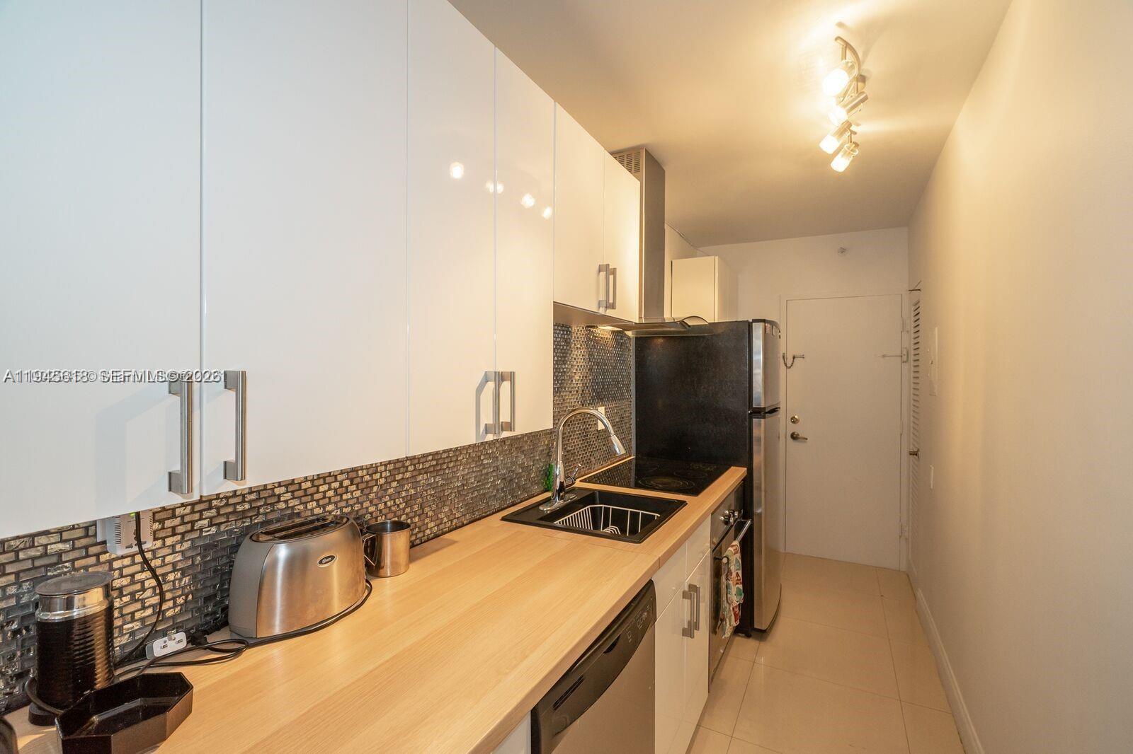 100 Lincoln Road, Unit 503 Miami Beach, FL 33139 - Photo 18 of 25 a bathroom with a sink and a mirror
