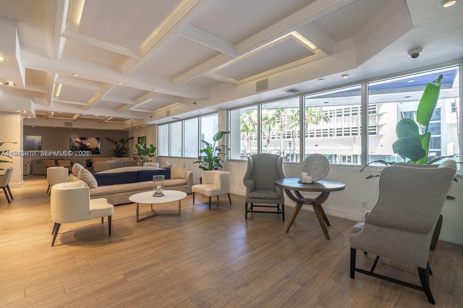 100 Lincoln Road, Unit 503 Miami Beach, FL 33139 - Photo 19 of 25 a living room with furniture and a large window