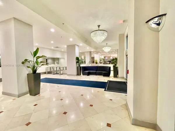 a room with gym equipment and large windows