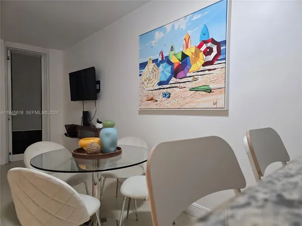 a workspace with furniture and painting on the wall