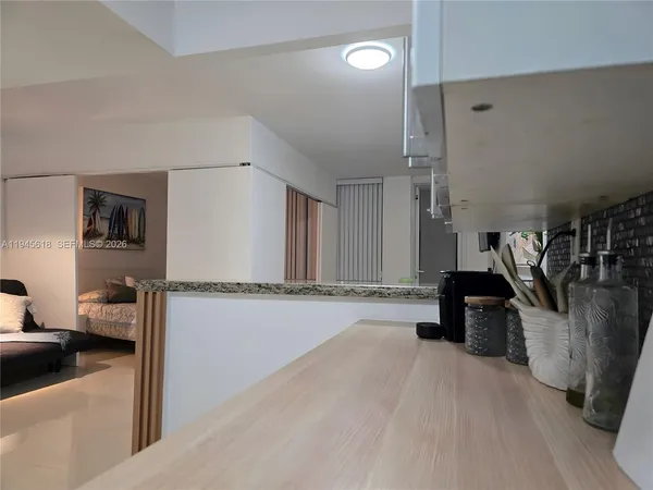 a view of a living room and a wooden floor