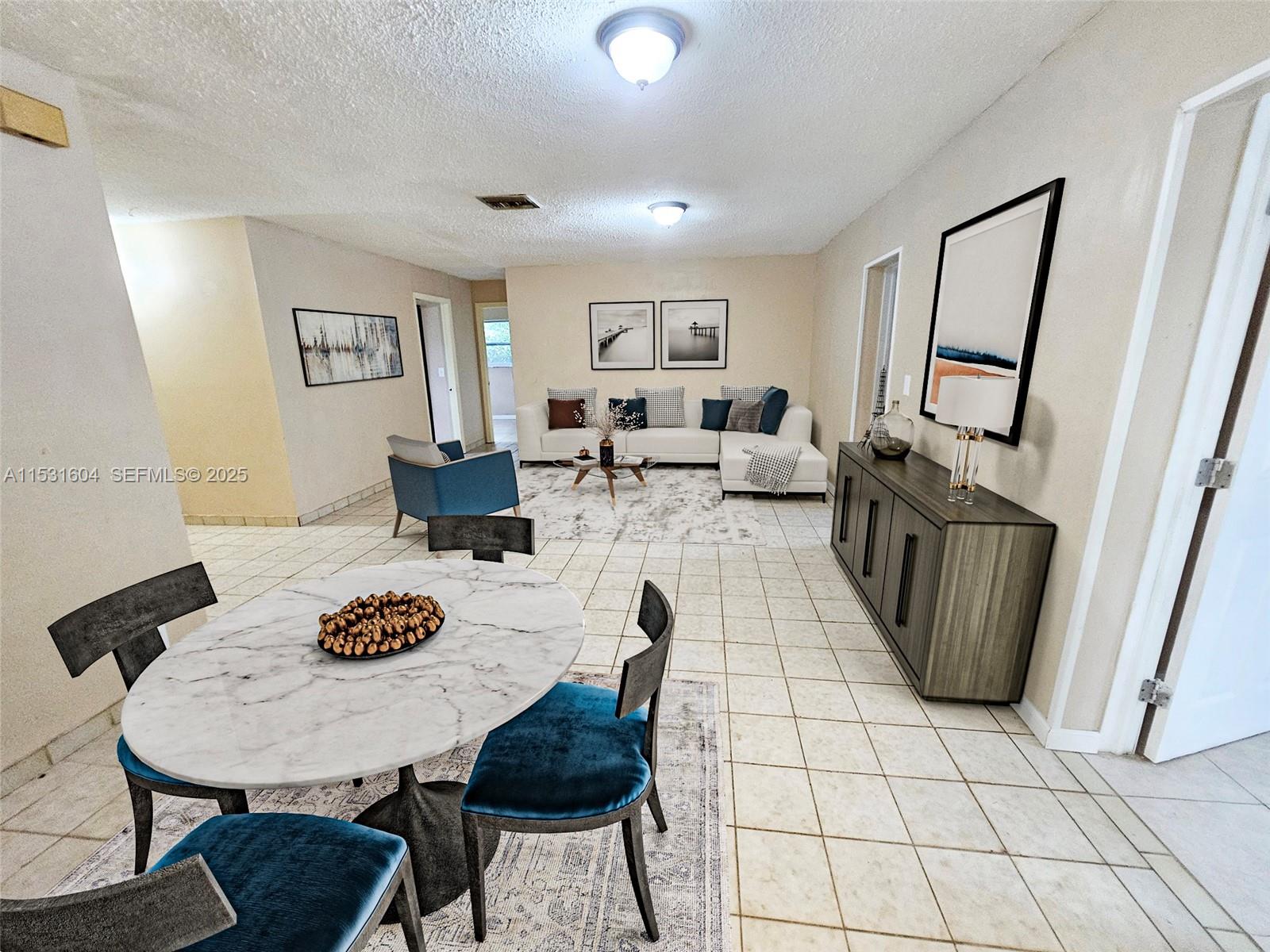 6990 Southwest 1st Street Margate, FL 33068 - Photo 1 of 33 Virtual Staging of the living room and dining area