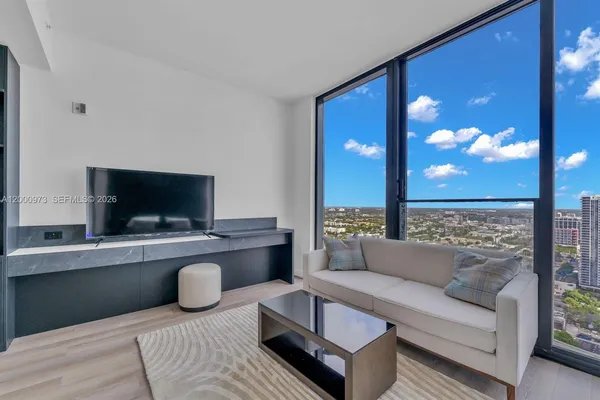 a bathroom with a sink a mirror and a shower