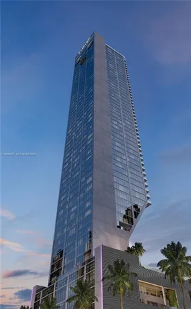 a tall brick building with a white roof