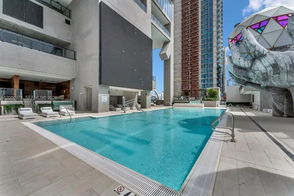 a view of a backyard with sitting area