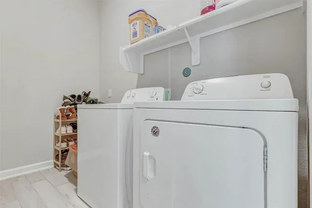 a utility room with dryer and washer