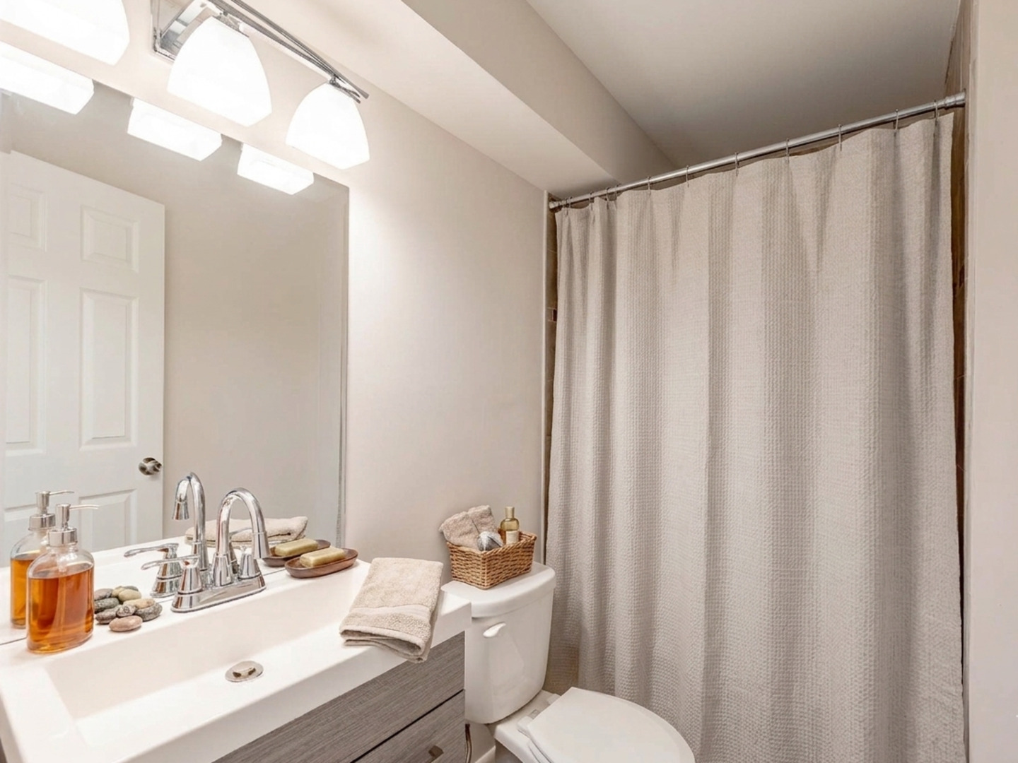18331 Hickory Street Lansing, IL 60438 - Photo 10 of 12 a bathroom with a sink a toilet and shower curtain