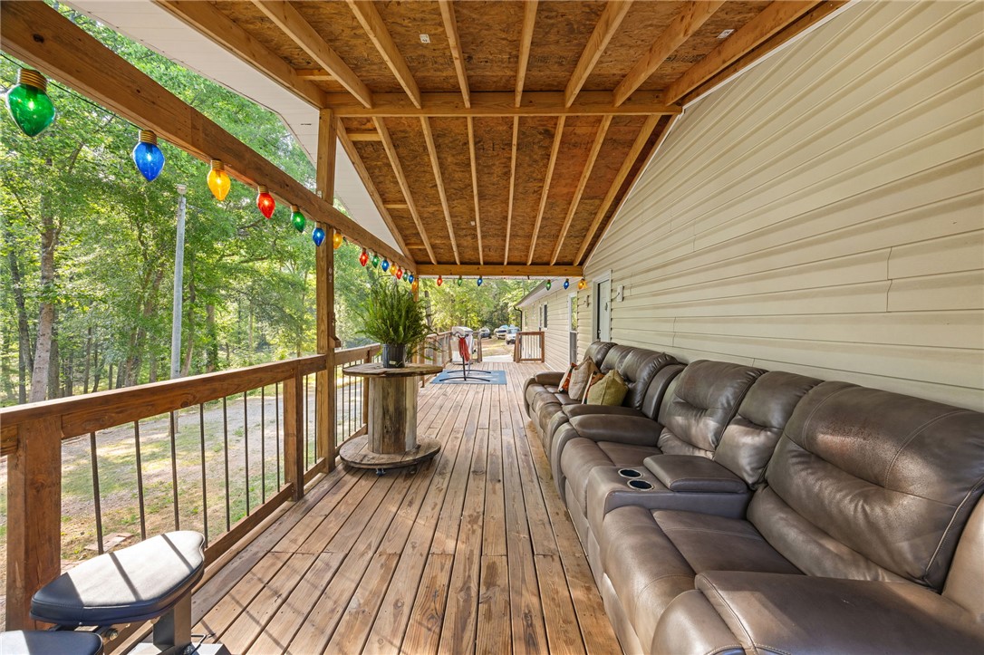 217 Old River Road Pelzer, SC 29669 - Photo 22 of 30 Relax on this ample deck featuring a charming wooden railing and verdant views.