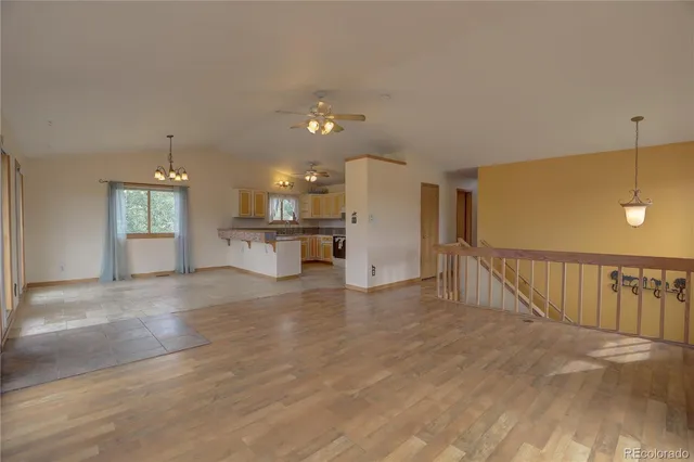 a view of a kitchen with a sink and a living room