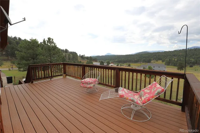 a view of deck with furniture and wooden floor