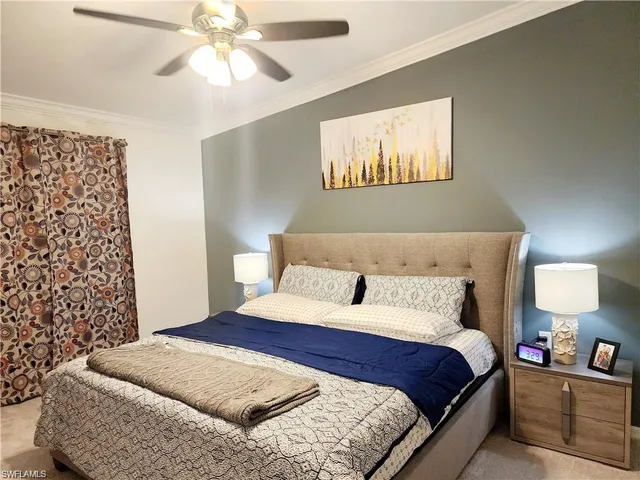 a bedroom with bed and a window