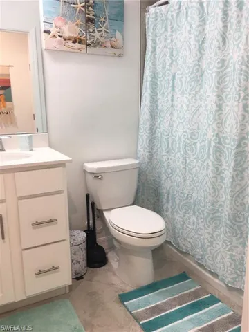 a bathroom with a toilet and a sink