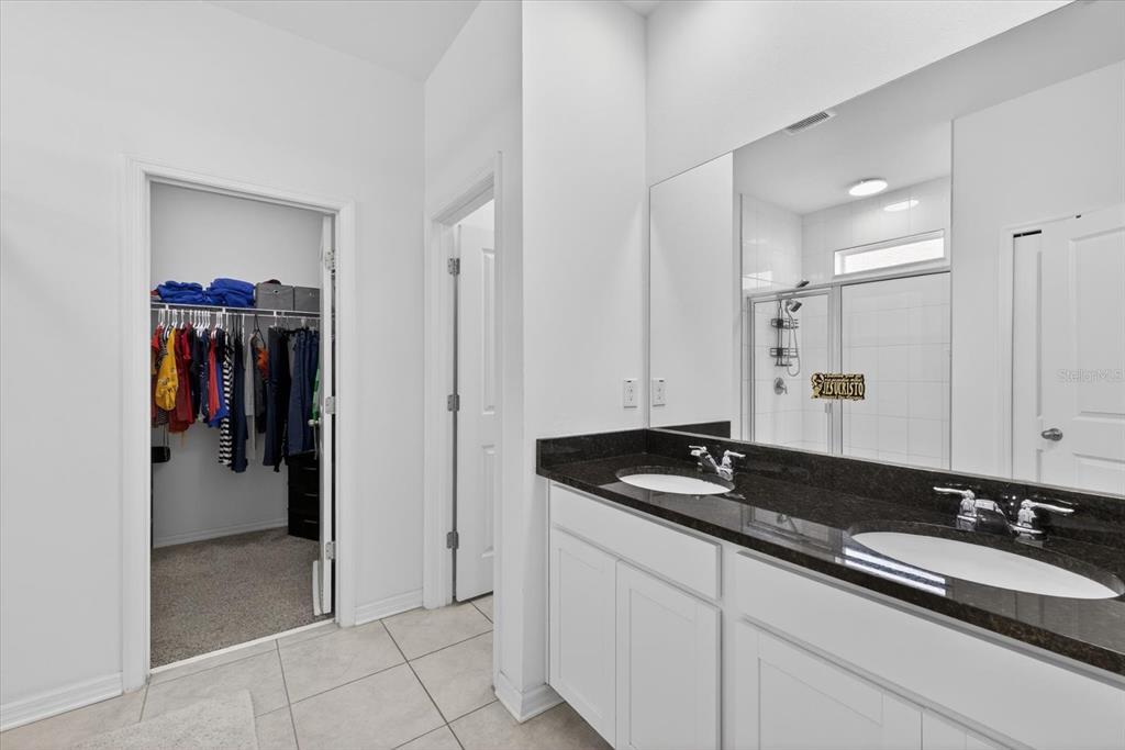11883 Brighton Knoll Loop Riverview, FL 33579 - Photo 11 of 45 a bathroom with a granite countertop sink and a mirror